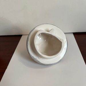 Teapot w dog and trash can